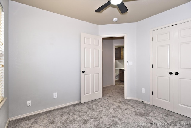 307 W K St, Jenks, OK 74037 - unfurnished bedroom with carpet flooring, a closet, baseboards, and ceiling fan
