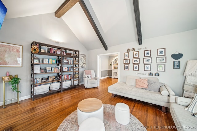2124 E 19th St, Tulsa, OK 74104 - living area featuring wood finished floors, beamed ceiling, baseboards, and high vaulted ceiling