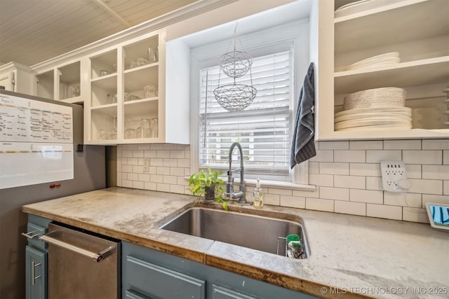 2124 E 19th St, Tulsa, OK 74104 - kitchen with open shelves, a sink, blue cabinetry, and tasteful backsplash