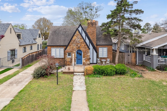 2124 E 19th St, Tulsa, OK 74104 - view of front of house featuring stone siding and a chimney