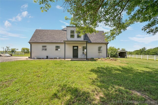 31102 S 4190th Rd, Inola, OK 74036 - rear view of property featuring roof with shingles, a detached carport, and a patio area