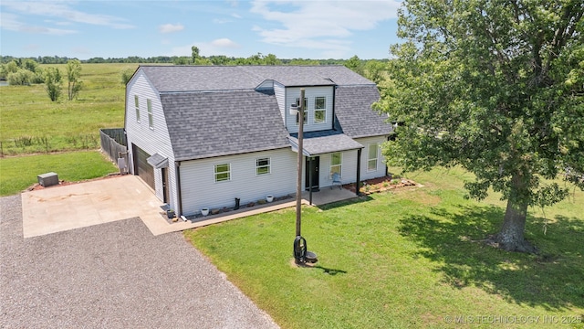 31102 S 4190th Rd, Inola, OK 74036 - colonial inspired home with driveway, roof with shingles, a garage, a front yard, and a gambrel roof