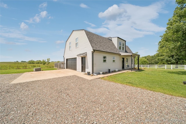 31102 S 4190th Rd, Inola, OK 74036 - view of home's exterior with driveway, roof with shingles, an attached garage, and a gambrel roof
