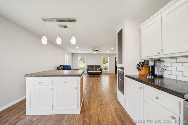 31102 S 4190th Rd, Inola, OK 74036 - kitchen with dark countertops, light wood-style floors, beverage cooler, and recessed lighting