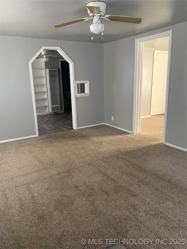 921 E 2nd St, Cushing, OK 74023 - empty room with ceiling fan, carpet floors, and baseboards