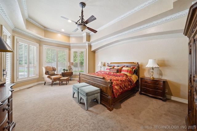 5912 E 119th St, Tulsa, OK 74137 - carpeted bedroom with ornamental molding, baseboards, multiple windows, a tray ceiling, and a ceiling fan