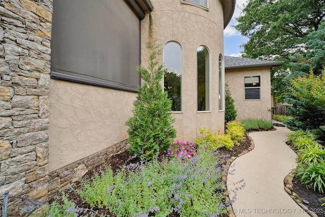 5912 E 119th St, Tulsa, OK 74137 - view of property exterior featuring stone siding and stucco siding