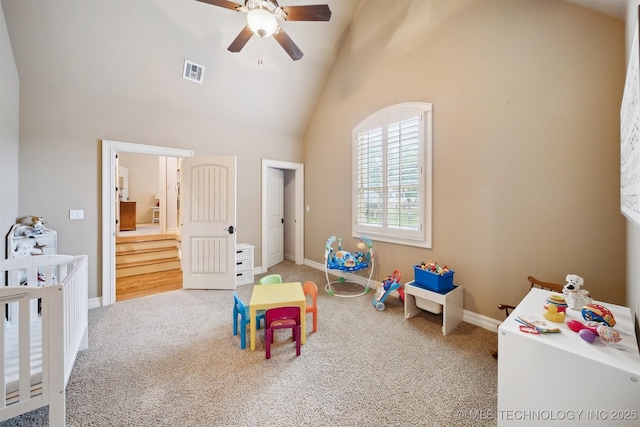 5912 E 119th St, Tulsa, OK 74137 - carpeted bedroom featuring high vaulted ceiling, baseboards, a crib, and ceiling fan