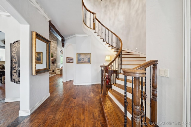 5912 E 119th St, Tulsa, OK 74137 - staircase with arched walkways, wood finished floors, baseboards, and ornamental molding