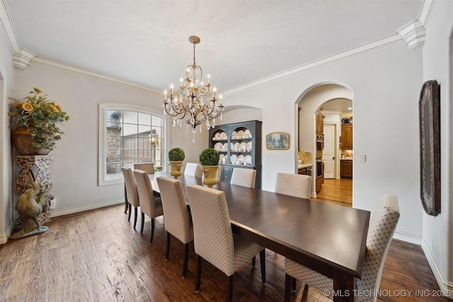 5912 E 119th St, Tulsa, OK 74137 - dining room featuring arched walkways, light wood-style flooring, crown molding, baseboards, and a chandelier