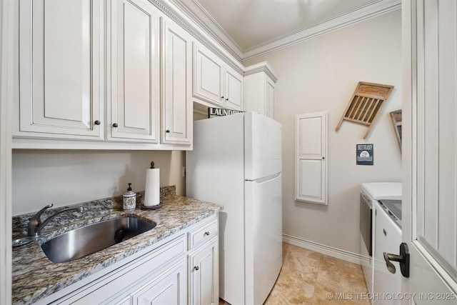 5912 E 119th St, Tulsa, OK 74137 - kitchen with a sink, freestanding refrigerator, ornamental molding, light stone countertops, and white cabinets