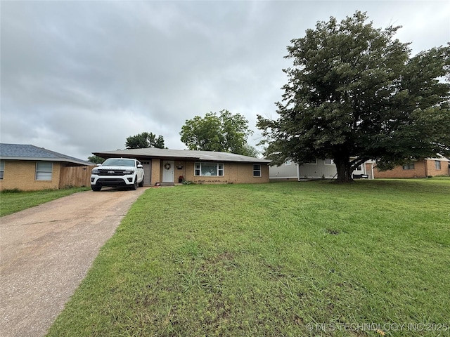 1436 E Broadway, Cushing, OK 74023 - ranch-style house featuring driveway, brick siding, and a front lawn