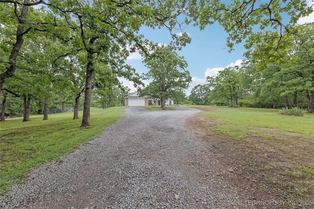 11587 W 86th St S, Sapulpa, OK 74066 - view of front of property featuring a front lawn, driveway, and a garage