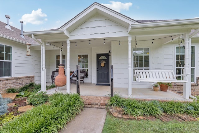 11587 W 86th St S, Sapulpa, OK 74066 - doorway to property with a porch and brick siding