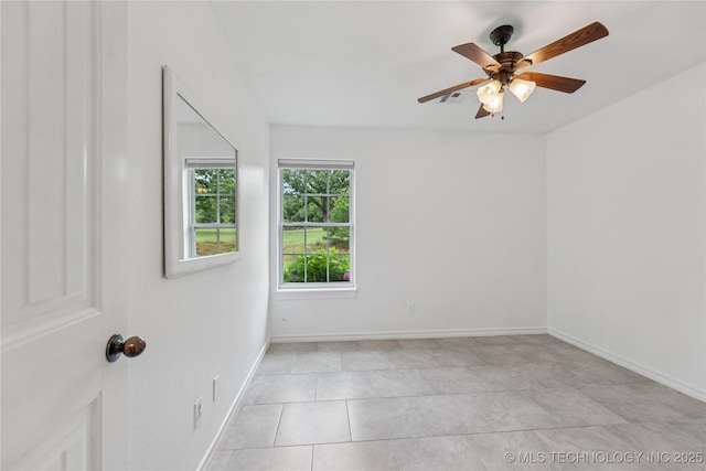 11587 W 86th St S, Sapulpa, OK 74066 - spare room featuring a ceiling fan, light tile patterned floors, and baseboards