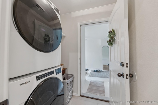 11587 W 86th St S, Sapulpa, OK 74066 - washroom featuring stacked washer and clothes dryer and light tile patterned floors