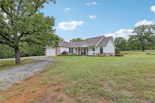11587 W 86th St S, Sapulpa, OK 74066 - single story home with gravel driveway, covered porch, an attached garage, a front lawn, and a shingled roof