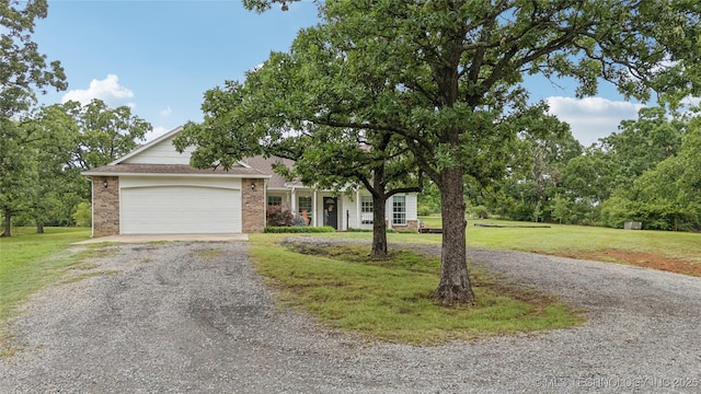 11587 W 86th St S, Sapulpa, OK 74066 - view of front of home featuring driveway, brick siding, an attached garage, and a front lawn