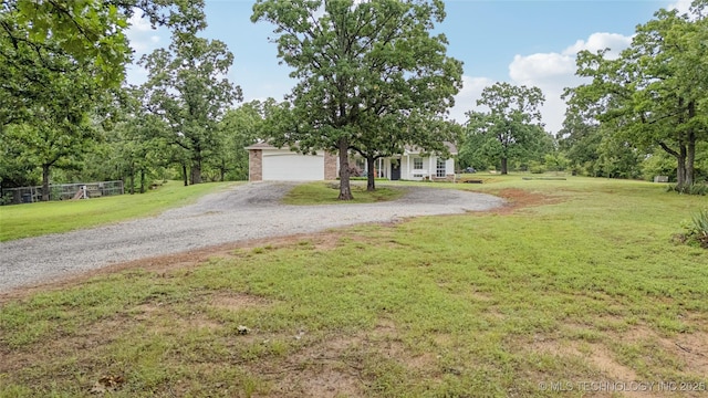 11587 W 86th St S, Sapulpa, OK 74066 - obstructed view of property with a garage and a front yard