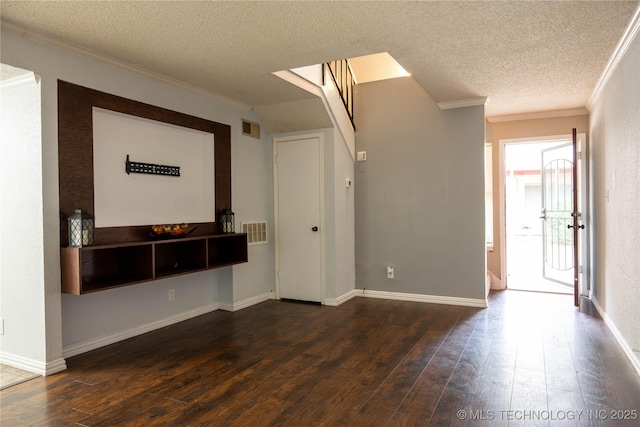 2213 E 67th St Unit 1405, Tulsa, OK 74136 - unfurnished living room with crown molding, a textured ceiling, dark wood finished floors, and baseboards