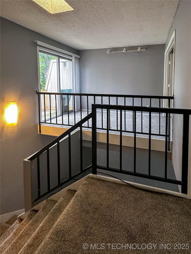 2213 E 67th St Unit 1405, Tulsa, OK 74136 - stairs with carpet, a textured ceiling, and a textured wall