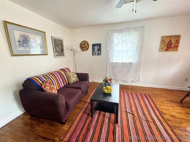 226 W Seneca St, Tahlequah, OK 74464 - living room with wood finished floors, a ceiling fan, and baseboards