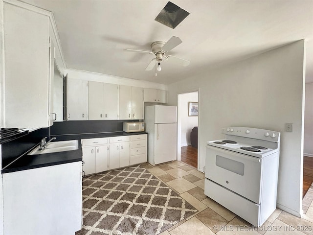 226 W Seneca St, Tahlequah, OK 74464 - kitchen featuring white appliances, a sink, dark countertops, and ceiling fan