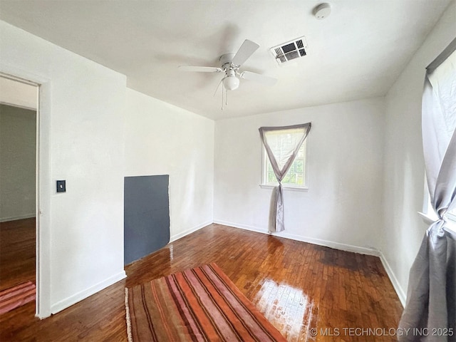226 W Seneca St, Tahlequah, OK 74464 - empty room with hardwood / wood-style floors, ceiling fan, and baseboards
