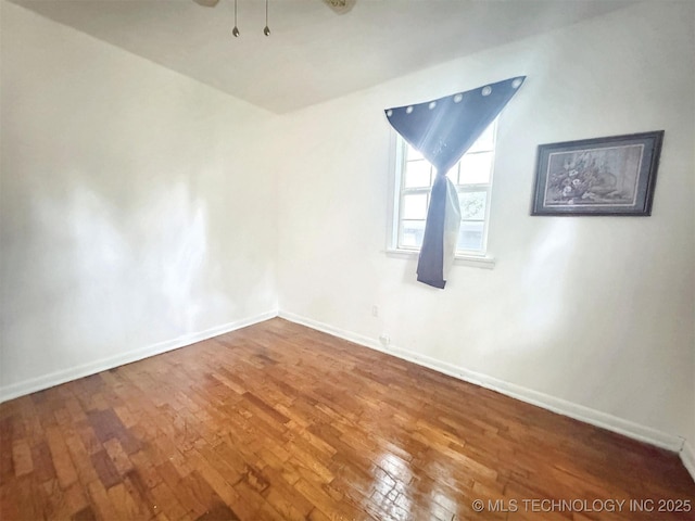 226 W Seneca St, Tahlequah, OK 74464 - spare room featuring wood-type flooring and baseboards