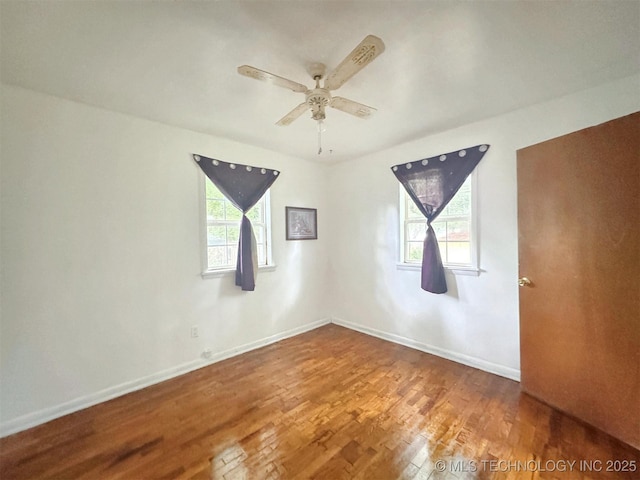 226 W Seneca St, Tahlequah, OK 74464 - empty room with plenty of natural light, hardwood / wood-style floors, ceiling fan, and baseboards