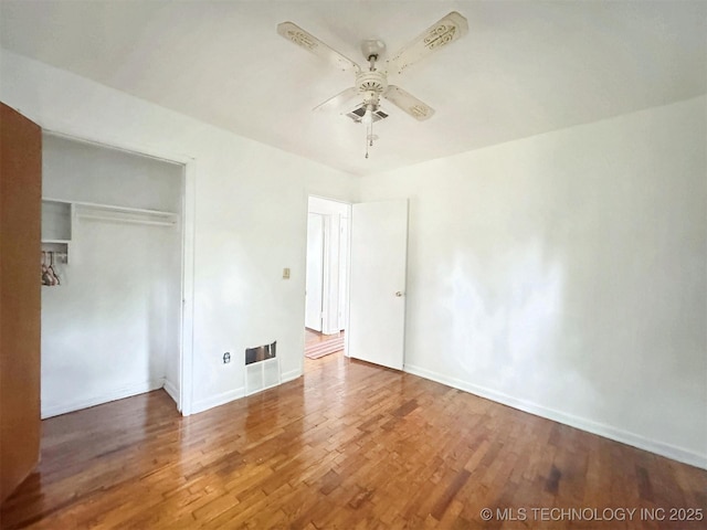 226 W Seneca St, Tahlequah, OK 74464 - unfurnished bedroom with wood finished floors, a closet, baseboards, and ceiling fan