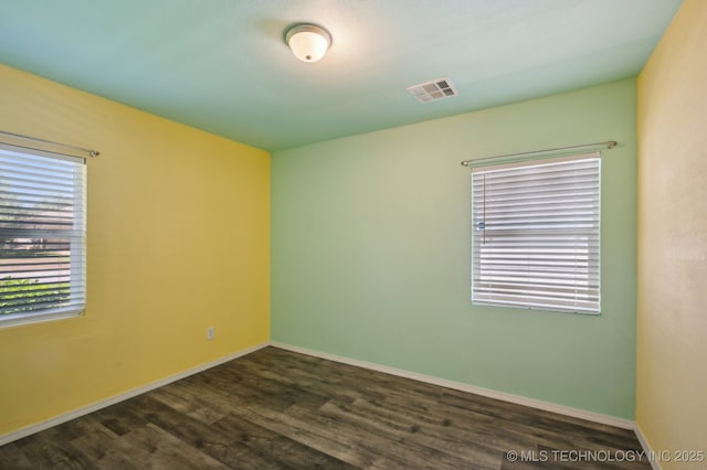 4126 E 36th Pl, Tulsa, OK 74135 - spare room with dark wood finished floors and baseboards