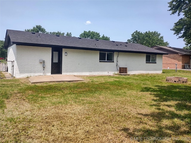 1400 NE 3rd St, Pryor, OK 74361 - rear view of house featuring a patio area, central AC unit, and brick siding