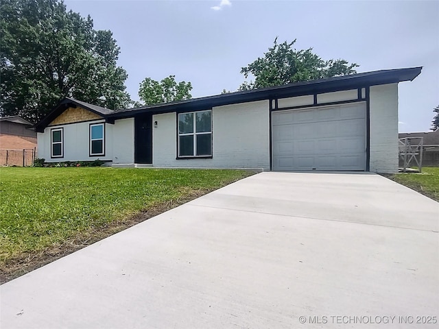 1400 NE 3rd St, Pryor, OK 74361 - view of front facade with concrete driveway and an attached garage