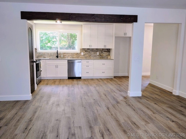 1400 NE 3rd St, Pryor, OK 74361 - kitchen featuring stainless steel appliances, a sink, white cabinetry, light wood finished floors, and light stone countertops