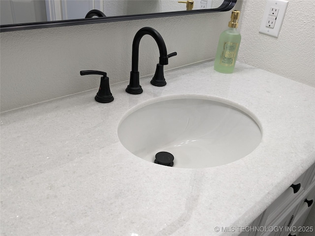 1400 NE 3rd St, Pryor, OK 74361 - bathroom view of a textured wall and vanity