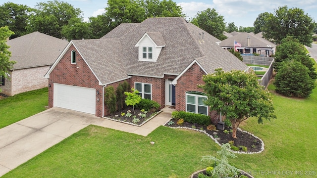 19804 E 45th St S, Broken Arrow, OK 74014 - view of front facade featuring brick siding, driveway, a front yard, a shingled roof, and a garage