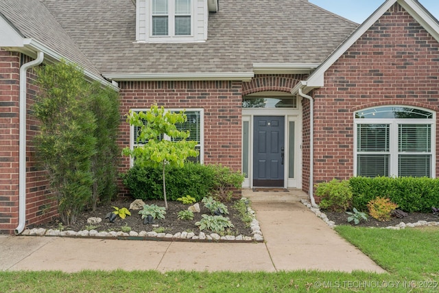 19804 E 45th St S, Broken Arrow, OK 74014 - property entrance featuring a shingled roof and brick siding