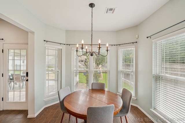 19804 E 45th St S, Broken Arrow, OK 74014 - dining area featuring a chandelier, dark wood-style floors, and baseboards