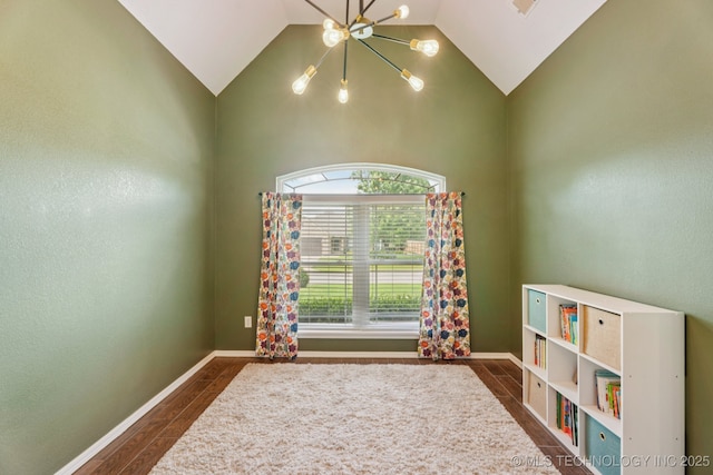 19804 E 45th St S, Broken Arrow, OK 74014 - recreation room with a chandelier, vaulted ceiling, dark wood-type flooring, and baseboards