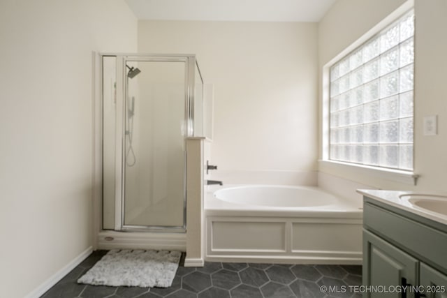 19804 E 45th St S, Broken Arrow, OK 74014 - bathroom featuring a stall shower, a bath, tile patterned floors, and vanity