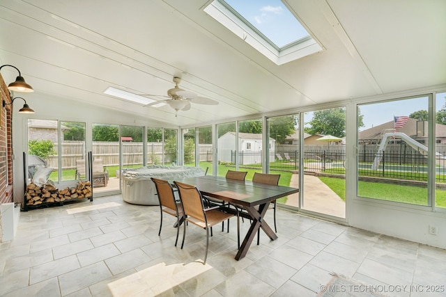 19804 E 45th St S, Broken Arrow, OK 74014 - sunroom / solarium featuring a skylight, outdoor dining space, plenty of natural light, and vaulted ceiling