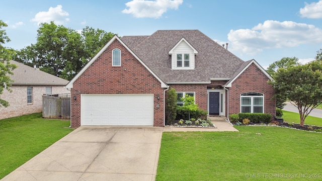 19804 E 45th St S, Broken Arrow, OK 74014 - view of front facade with brick siding, concrete driveway, and a shingled roof