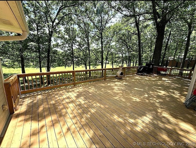 3109 Buffalo Ln, Grove, OK 74344 - wooden deck with view of scattered trees
