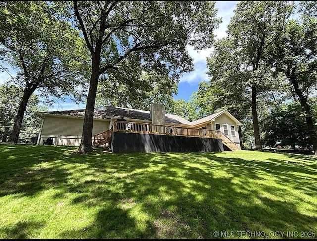 3109 Buffalo Ln, Grove, OK 74344 - view of green lawn with stairway and a deck