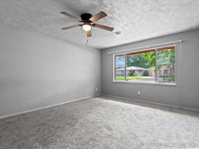 1921 S Santa Fe Pl, Bartlesville, OK 74003 - carpeted empty room featuring a textured ceiling and a ceiling fan