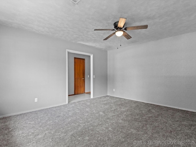 1921 S Santa Fe Pl, Bartlesville, OK 74003 - carpeted spare room featuring a ceiling fan and a textured ceiling