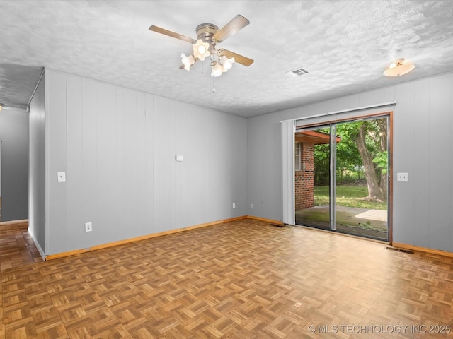 1921 S Santa Fe Pl, Bartlesville, OK 74003 - empty room with a ceiling fan and a textured ceiling