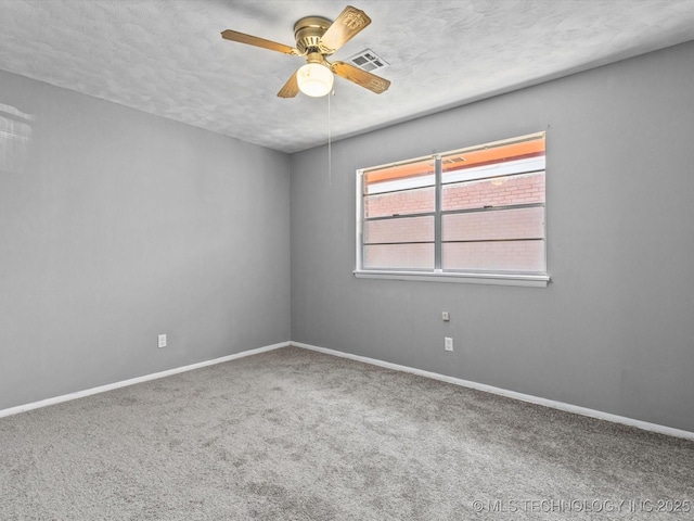 1921 S Santa Fe Pl, Bartlesville, OK 74003 - carpeted spare room with a ceiling fan and a textured ceiling