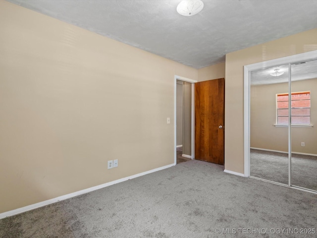 1921 S Santa Fe Pl, Bartlesville, OK 74003 - unfurnished bedroom featuring carpet and a closet